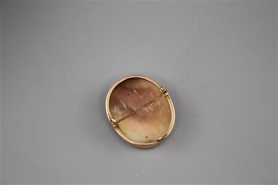 A yellow metal mounted oval cameo brooch, carved with the head of a lady to sinister, 40mm, gross weight 9.1 grams.